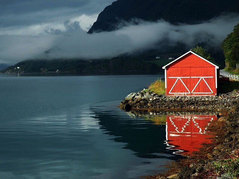 Red Boathouse on Shore