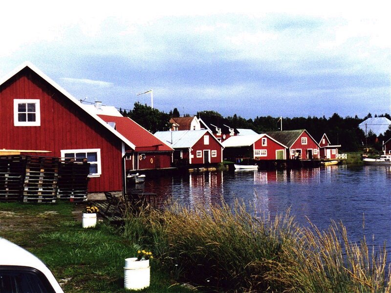 Red boathouses by the water