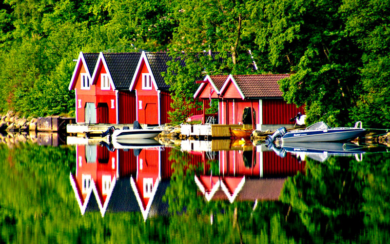 Red Boathouses on Lake