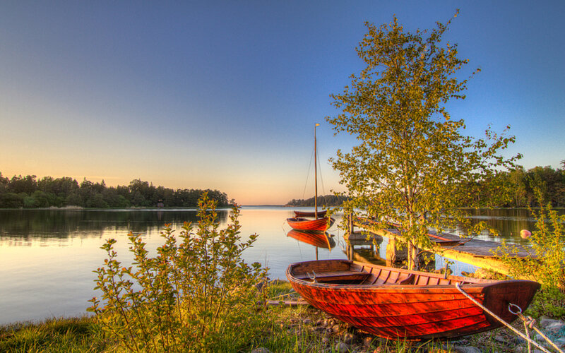 Red Boats on Lake Shore