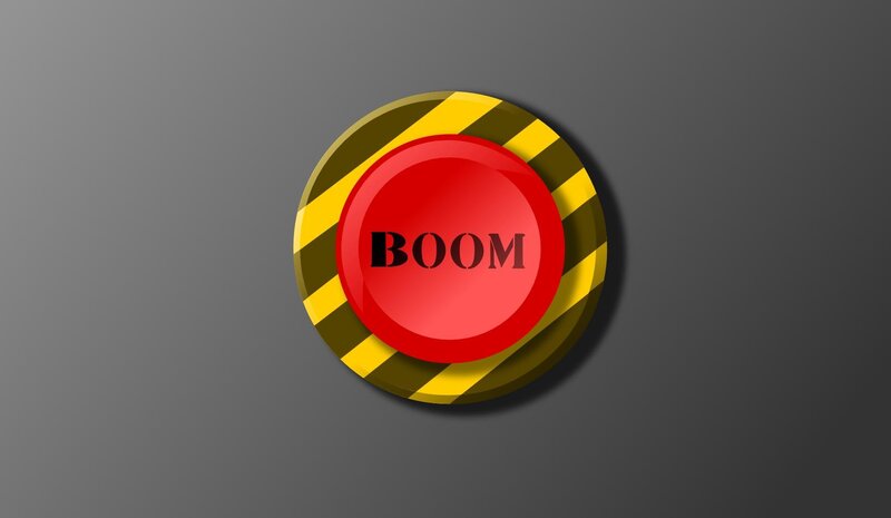 red boom button with hazard stripes