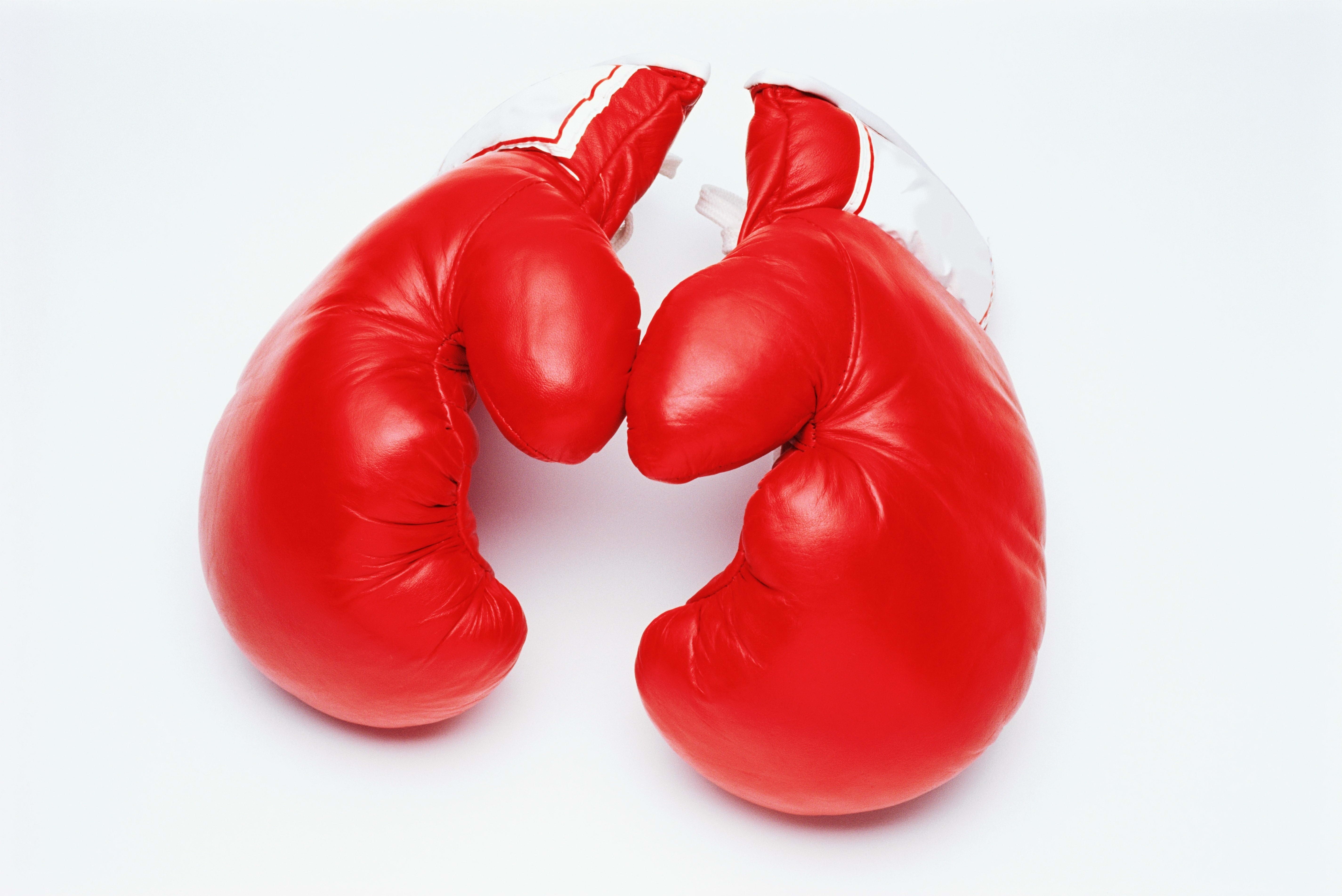 red boxing gloves on white