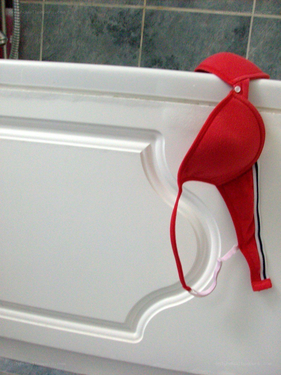 Red bra on bathtub edge