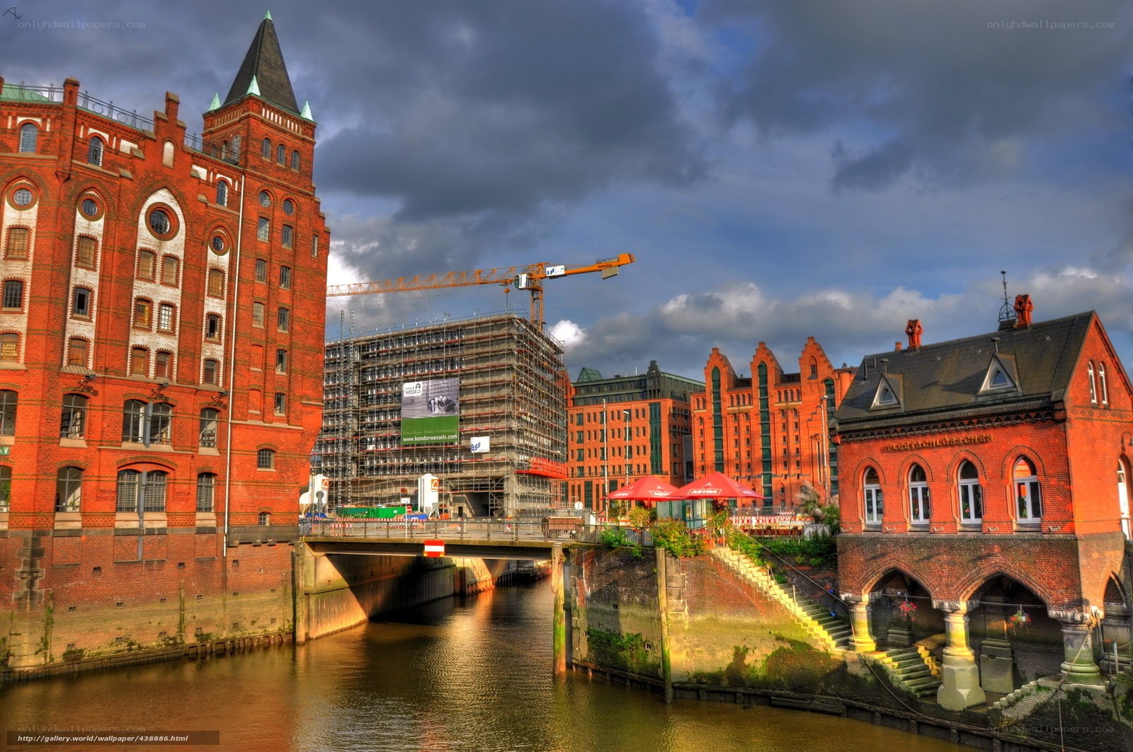 Red brick buildings by canal