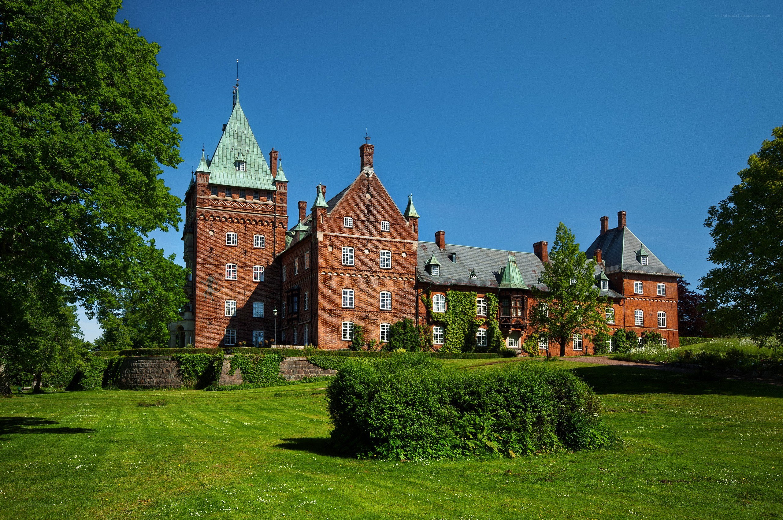 Red brick castle with green roof