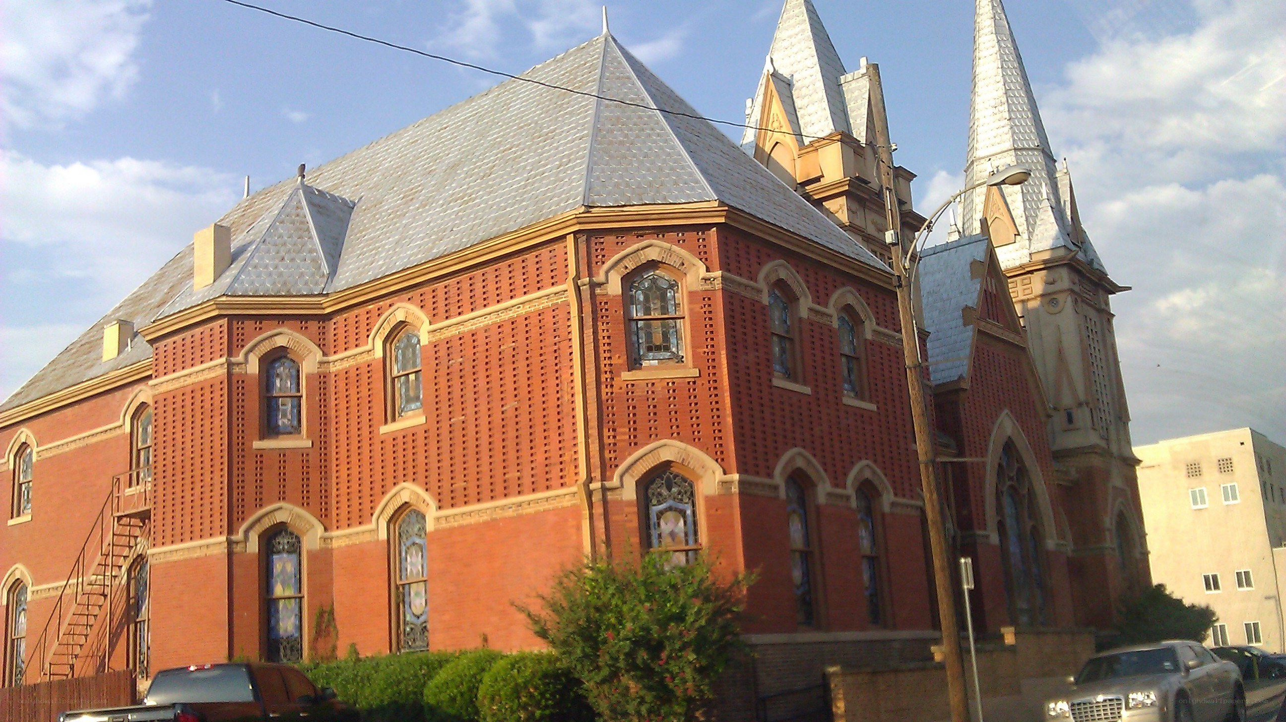 red brick church with spires