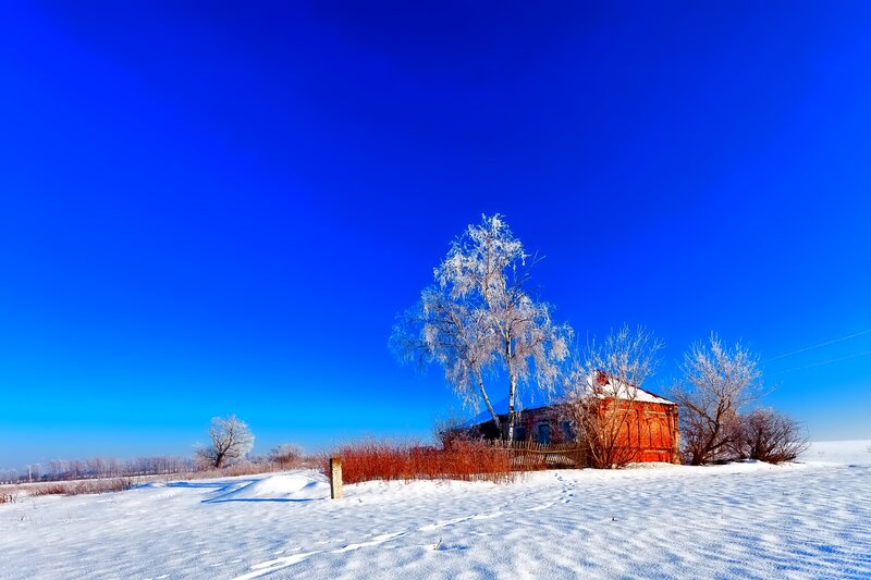Red Brick House in Snow