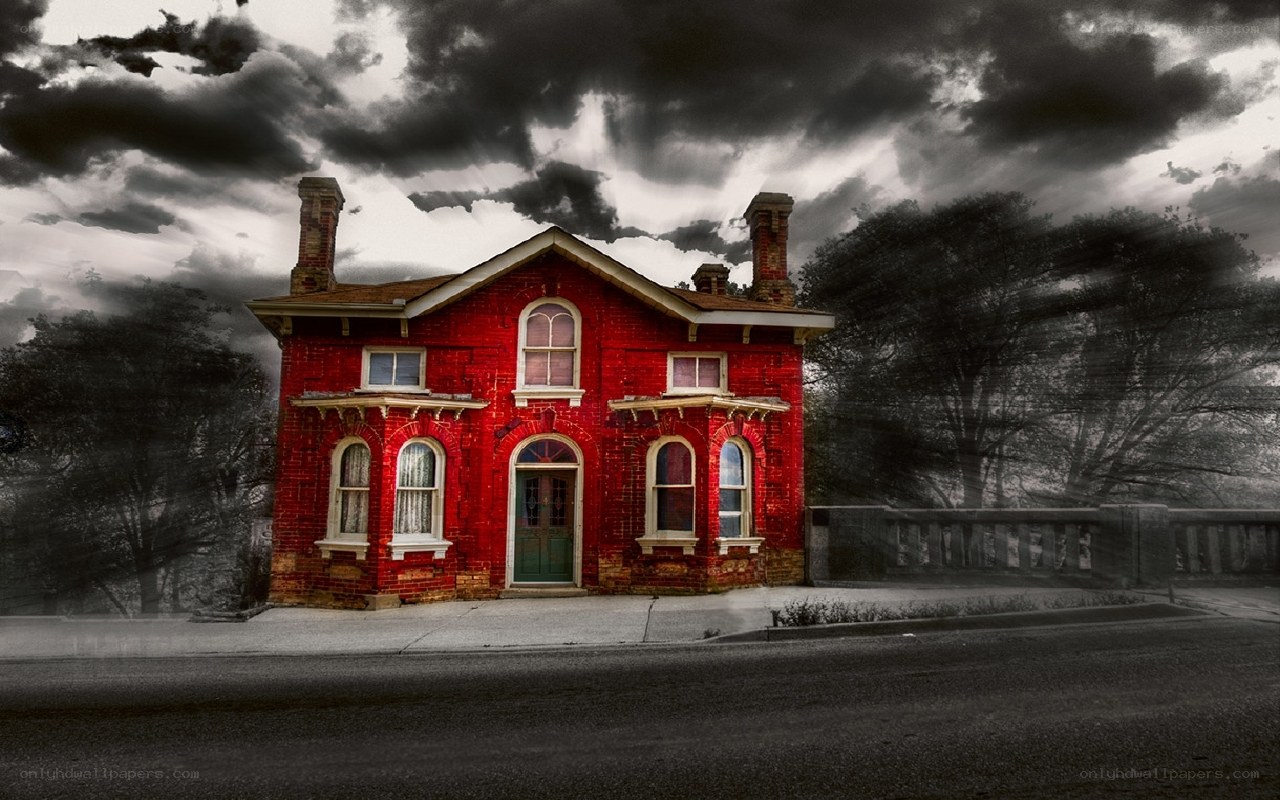 Red brick house under stormy sky