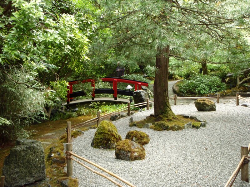 Red Bridge in Garden — Green, Serene, Afternoon, Photograph, Gravel