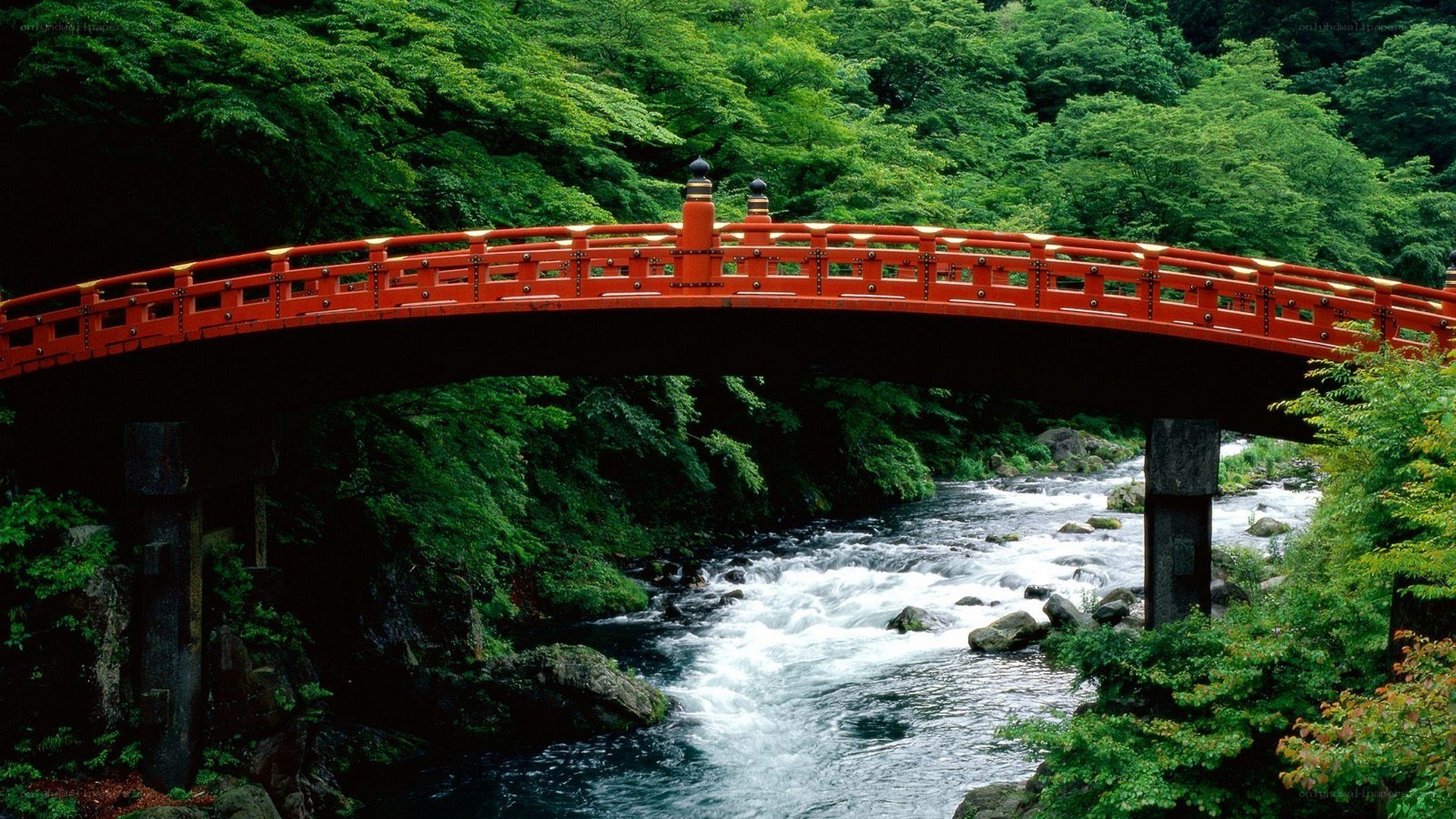 Red bridge over a river