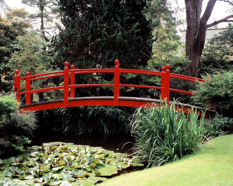 Red bridge over pond