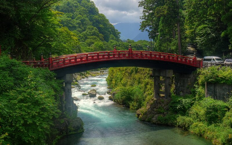 Red Bridge over River — Green, Serene, Afternoon, Photograph