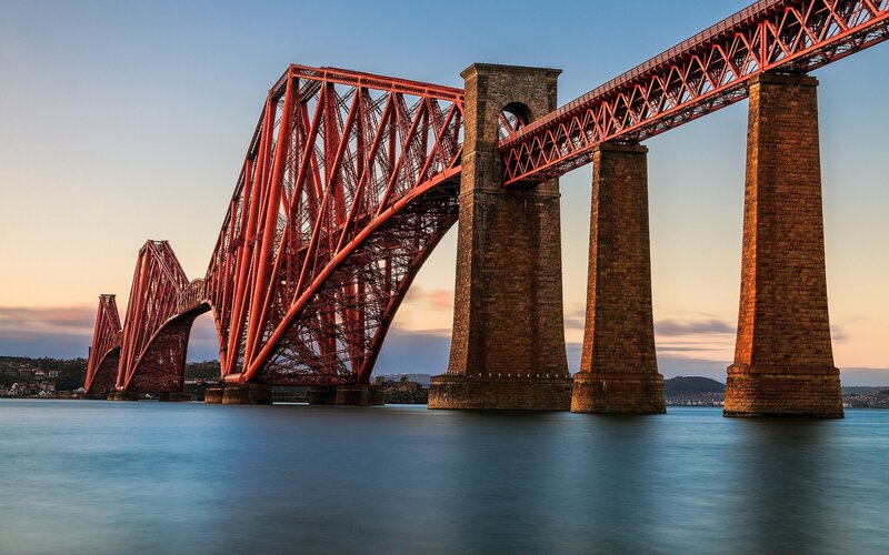 Red Bridge over Water — Serene, Sunset