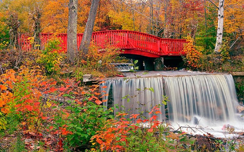 Red Bridge over Waterfall