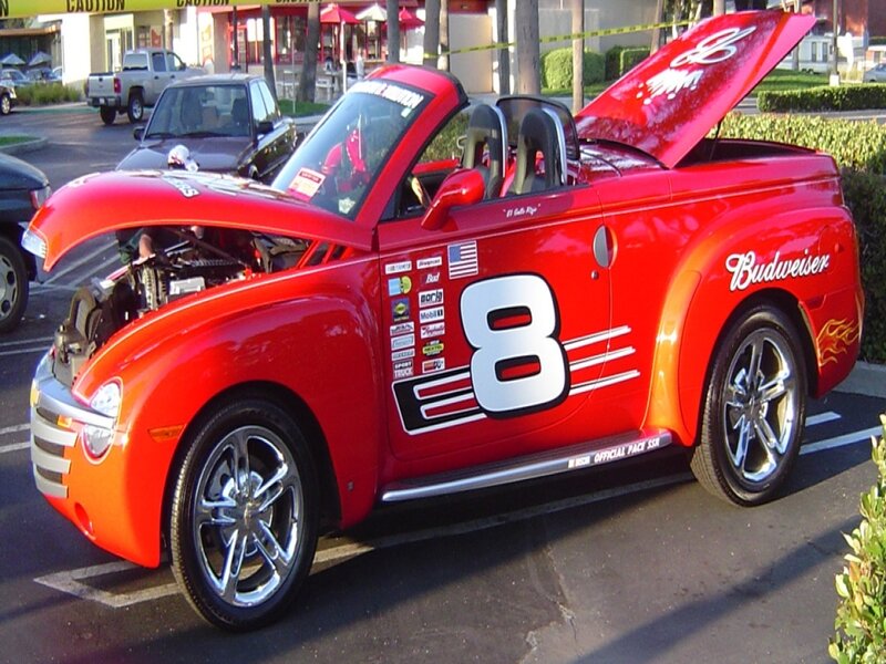 red budweiser car with open hood