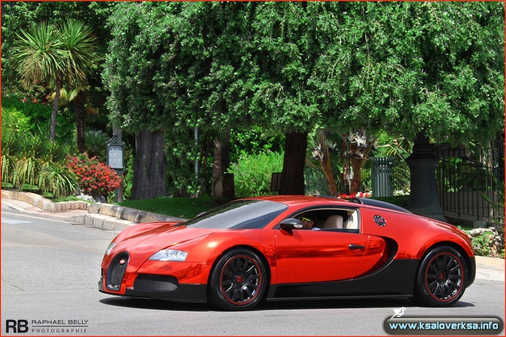 Red Bugatti Veyron on a tree-lined street