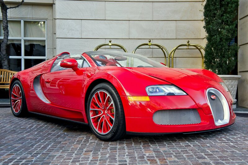 Red Bugatti Veyron parked outside