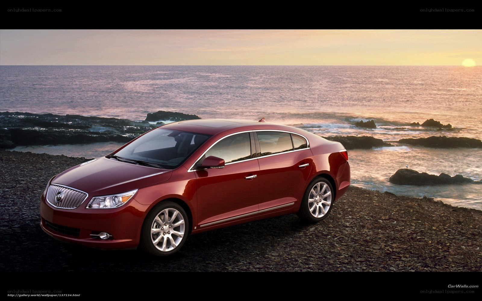 Red Buick LaCrosse by the ocean