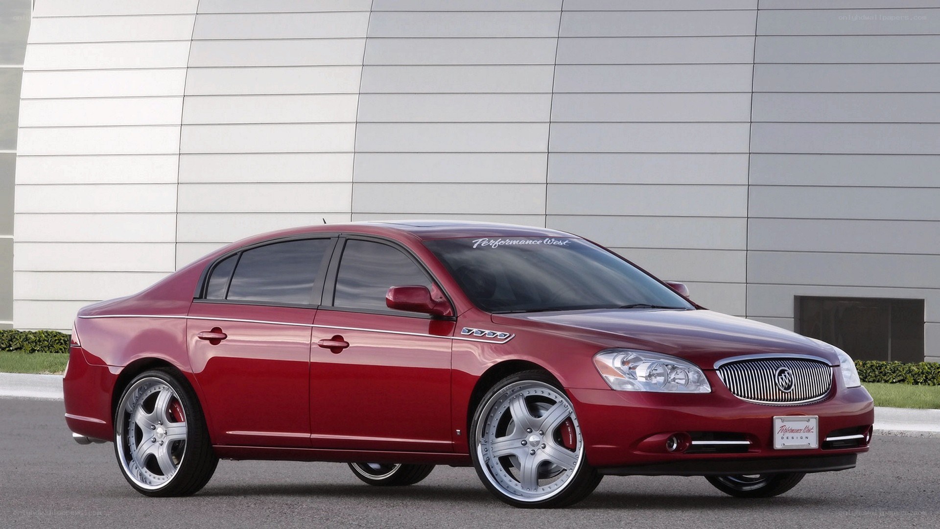 Red Buick Lucerne sedan