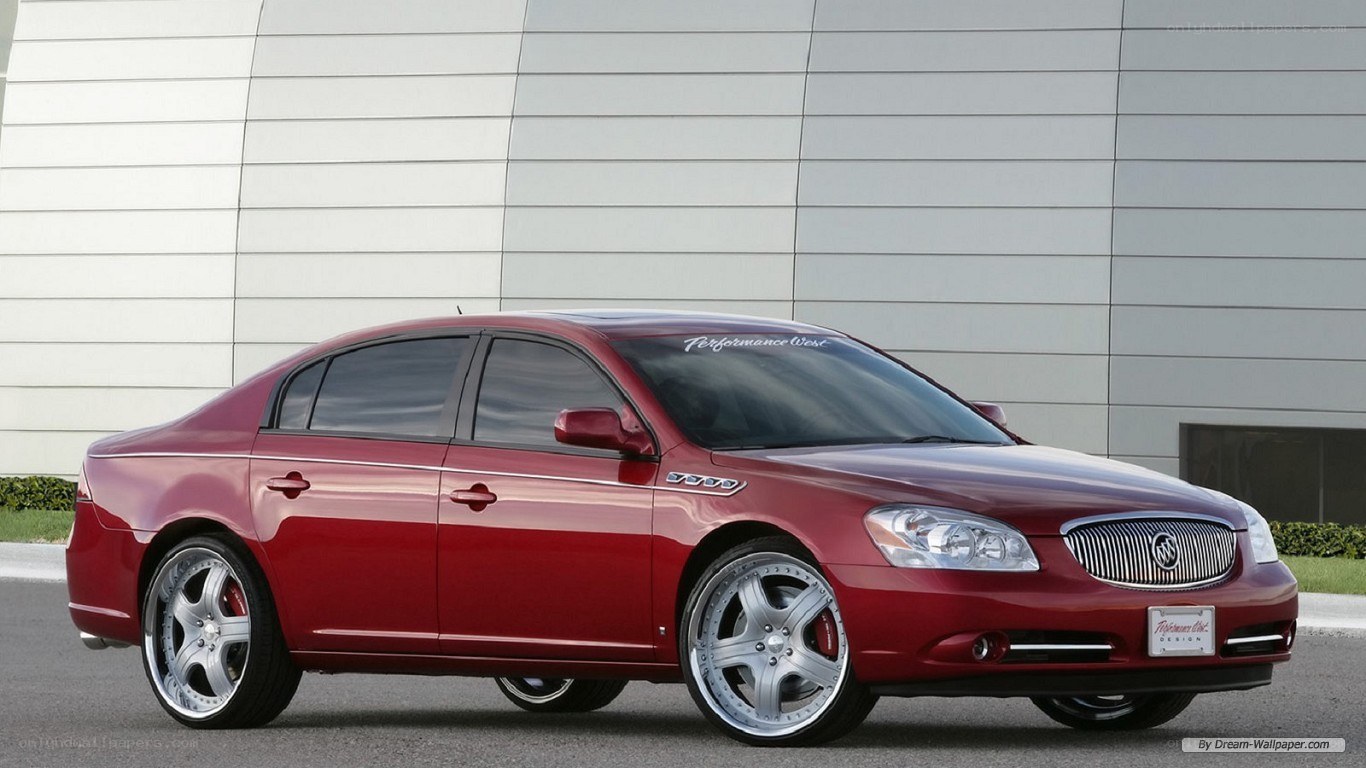 red buick sedan with custom wheels