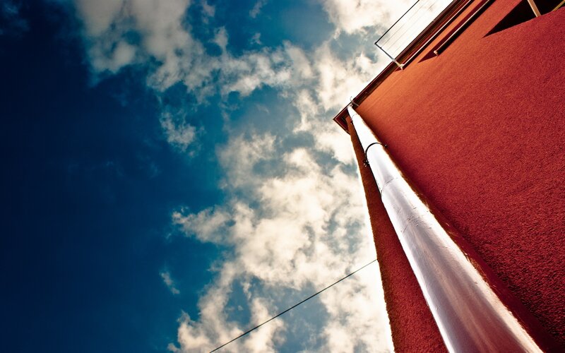 Red building against blue sky