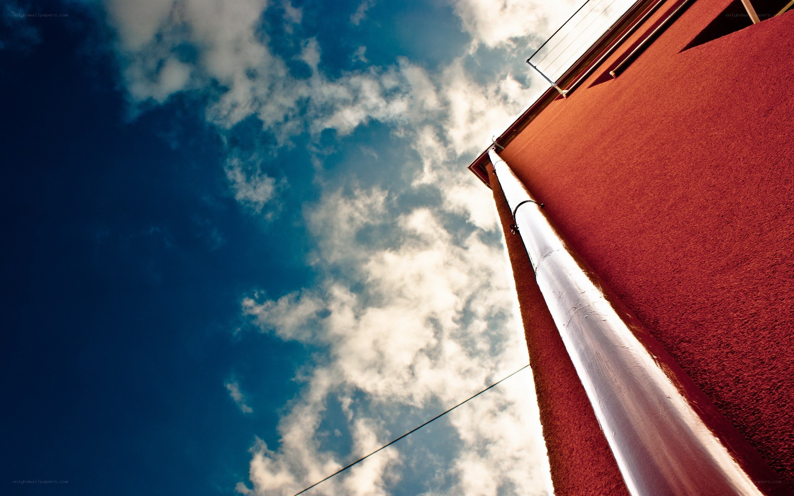 Red building against blue sky