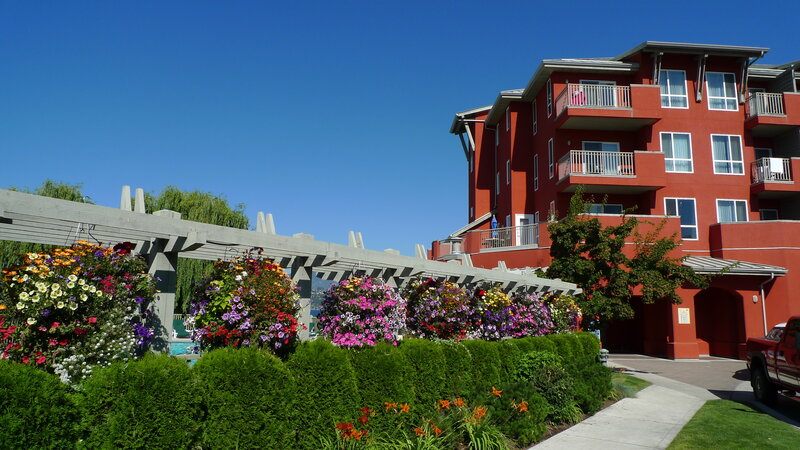 Red building with flower garden