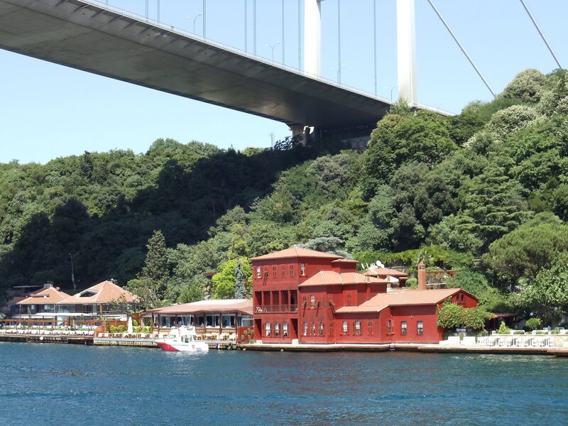 Red buildings under a bridge