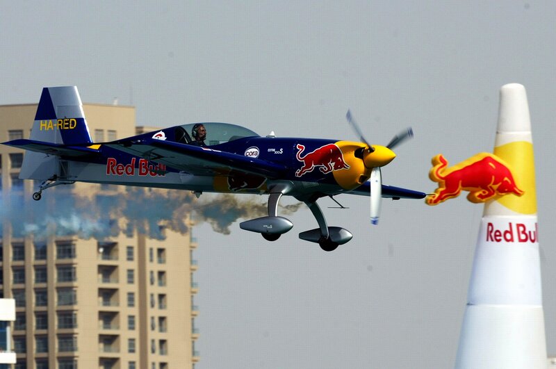 Red Bull aerobatic plane in flight