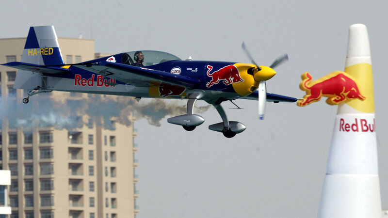 Red Bull aerobatic plane in flight