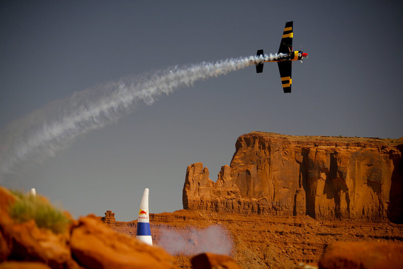 Red Bull aerobatic plane in flight
