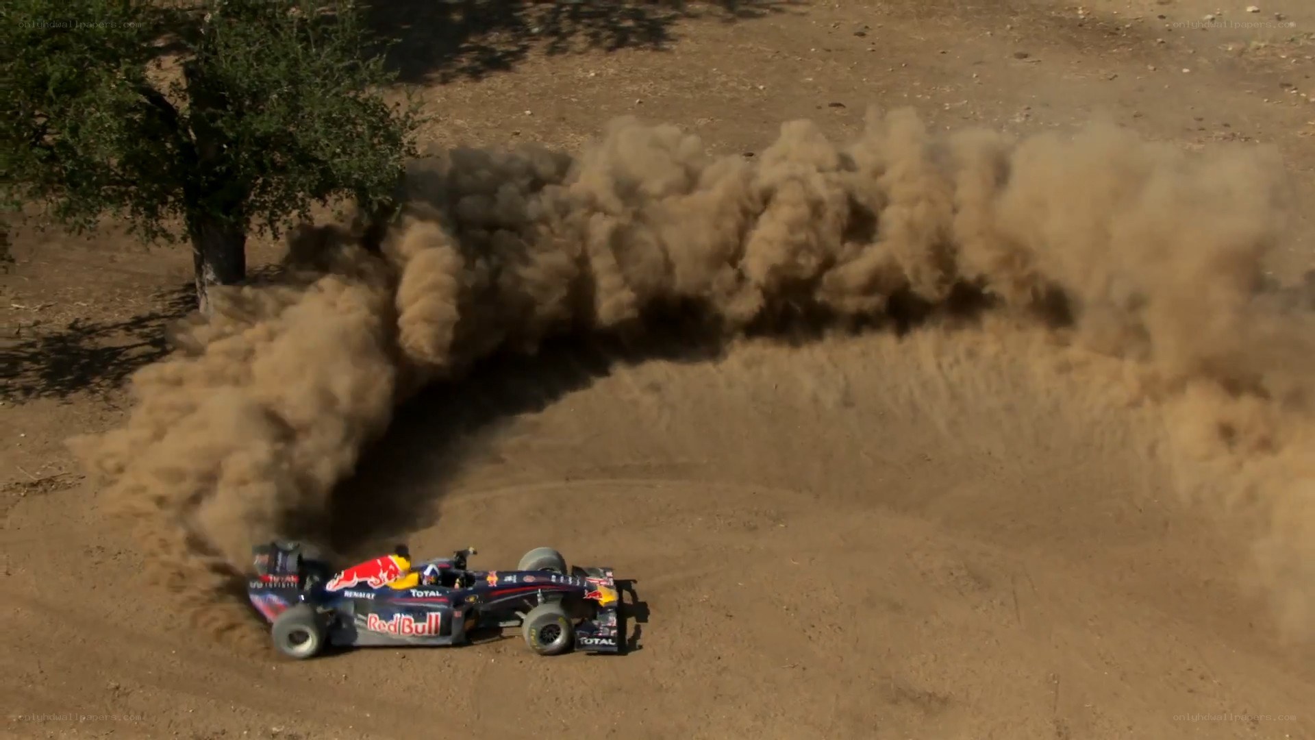 Red Bull car drifting in dust