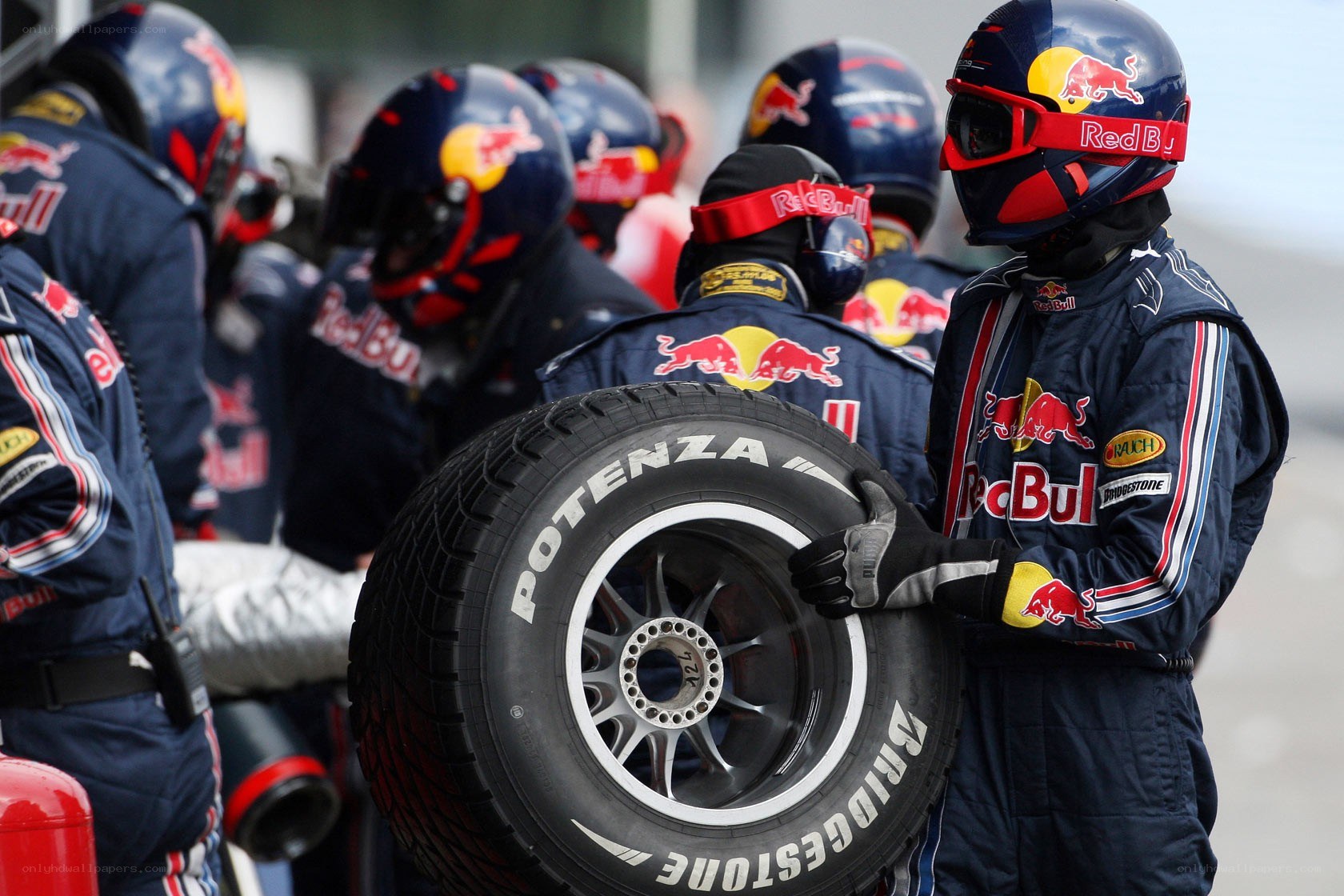 Red Bull pit crew with tire