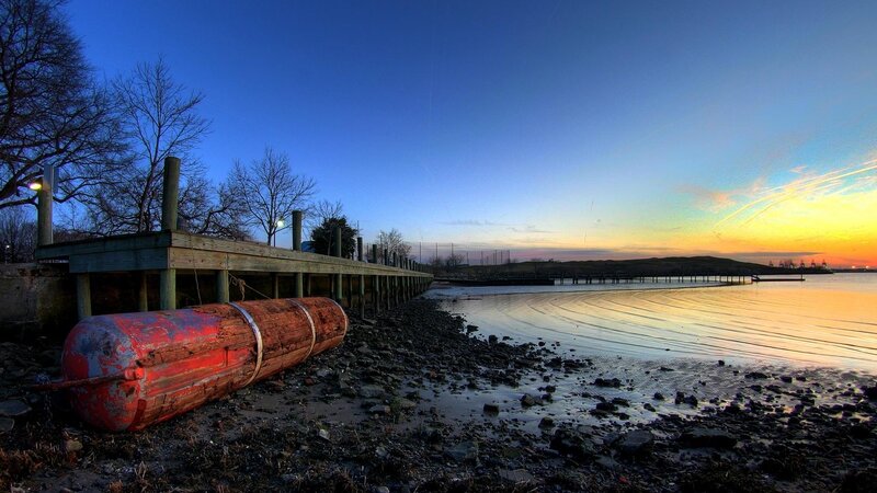 Red Buoy on Shore