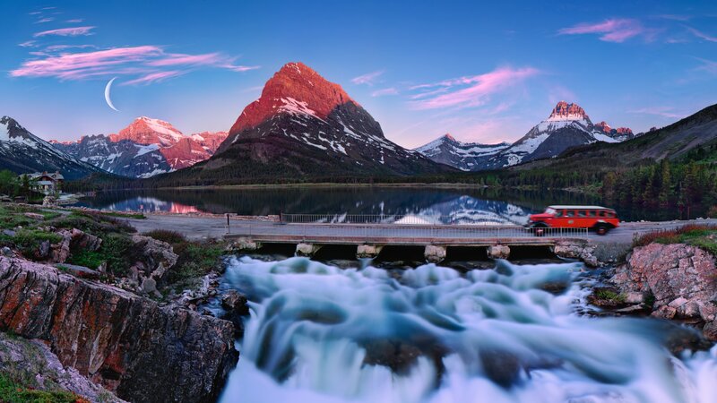 Red bus at mountain lake