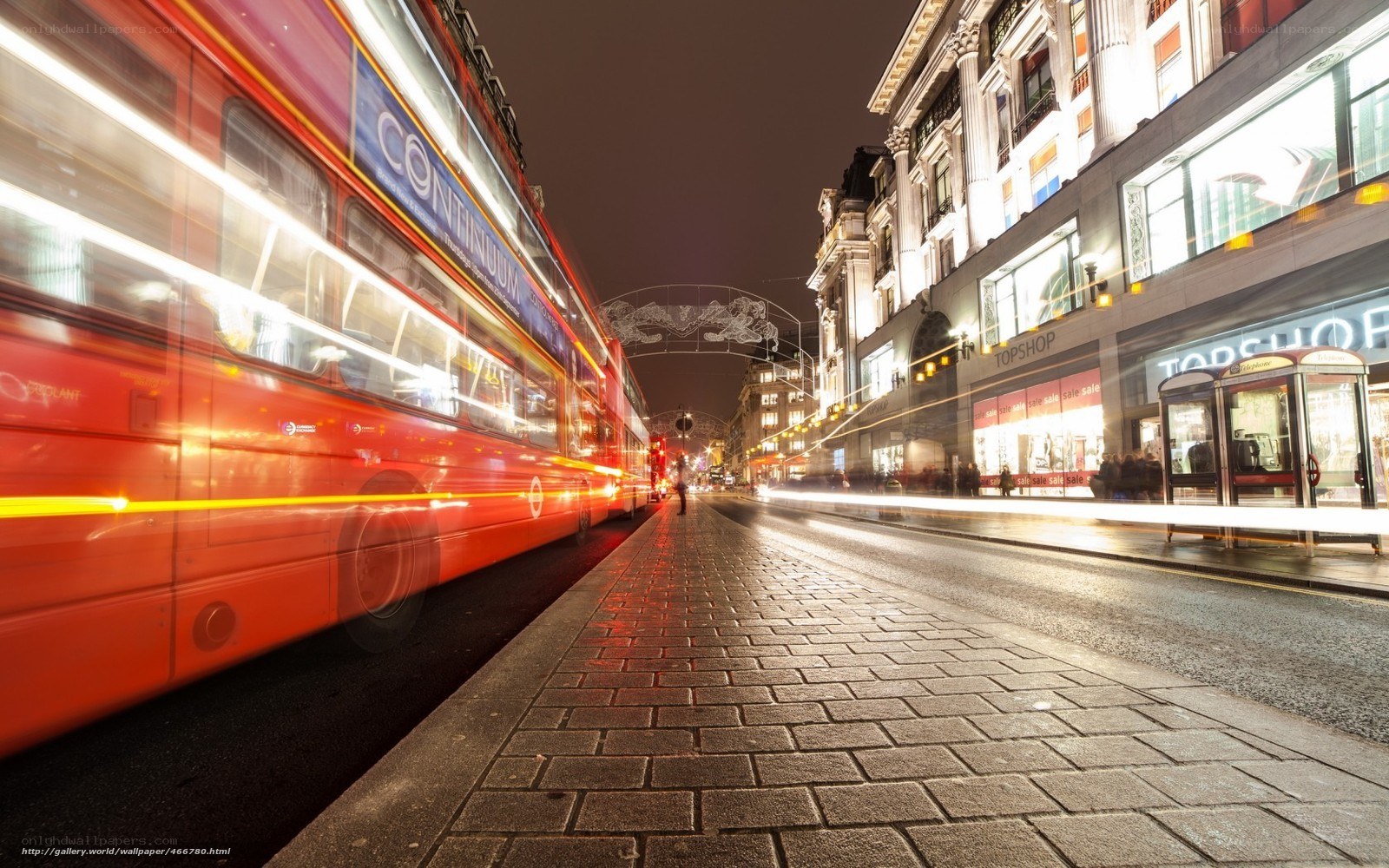 Red bus at night in London