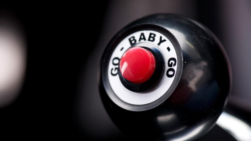red button on black knob