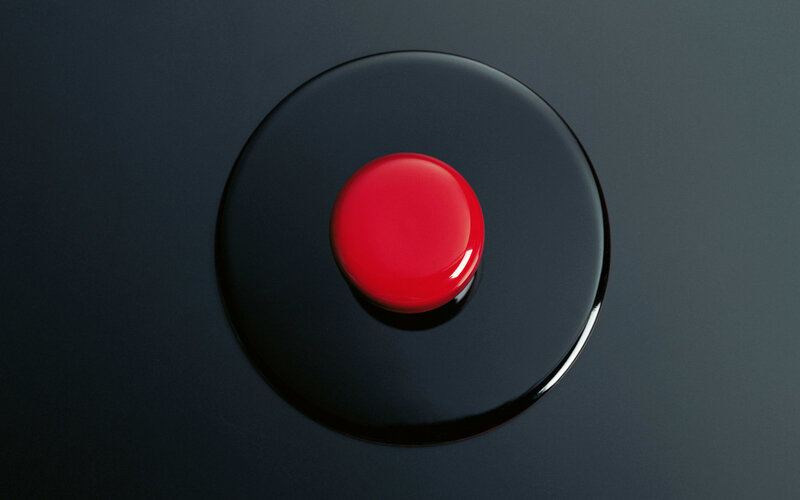 Red button on black surface