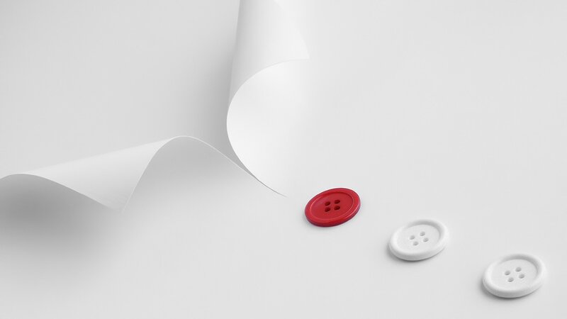 red button on white paper
