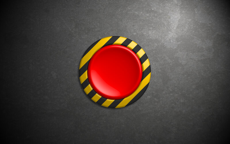 red button with hazard stripes