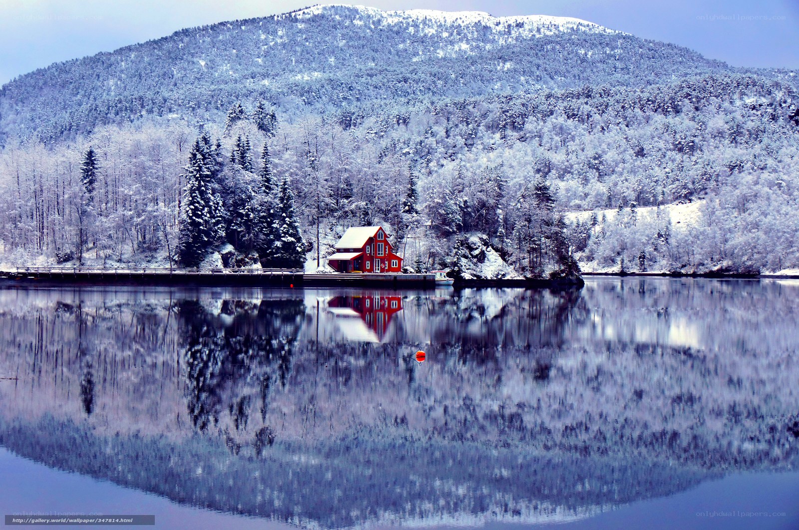 Red Cabin on a Snowy Lake