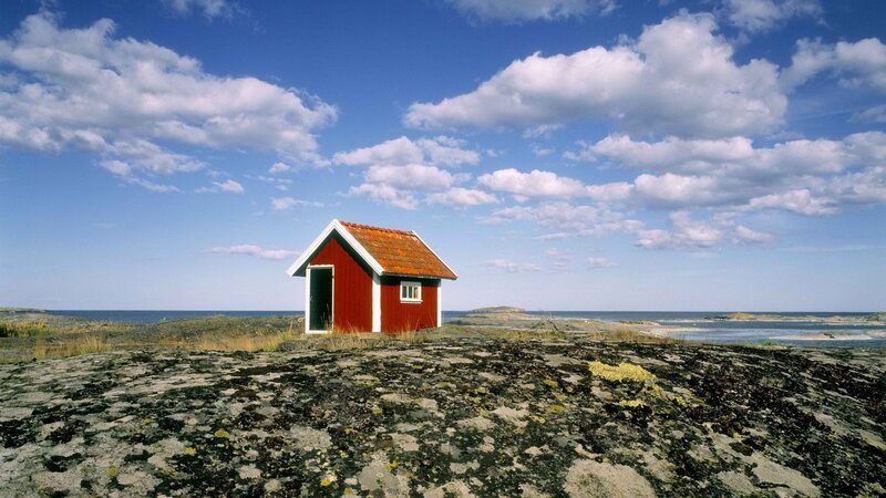 Red Cabin on Rocky Shore — Blue, Serene, Afternoon, Photograph