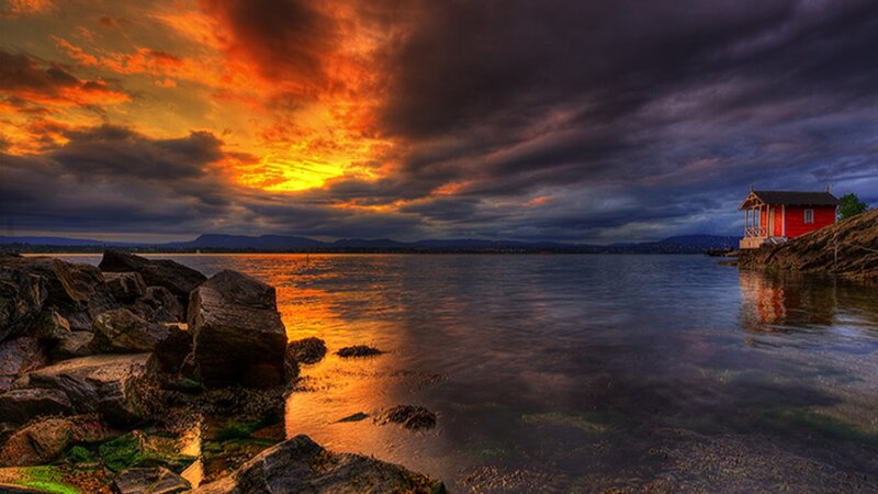 Red Cabin on Rocky Shore — Orange, Dramatic