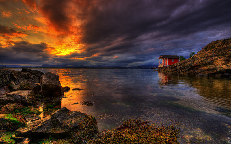 Red Cabin on Rocky Shore — Orange