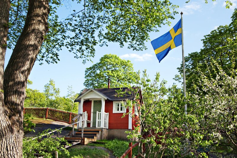 Red Cabin with Flag