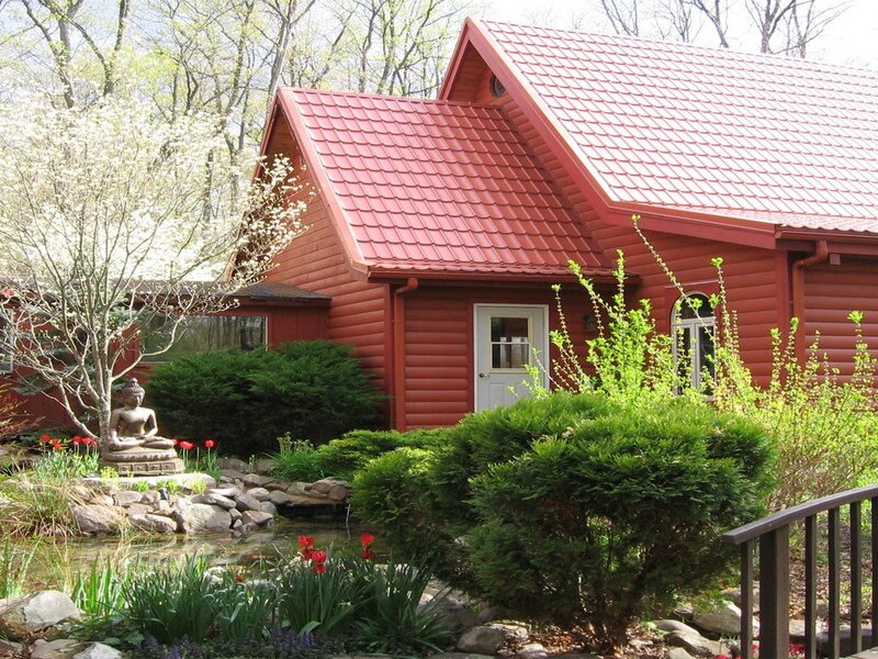 Red cabin with garden and pond