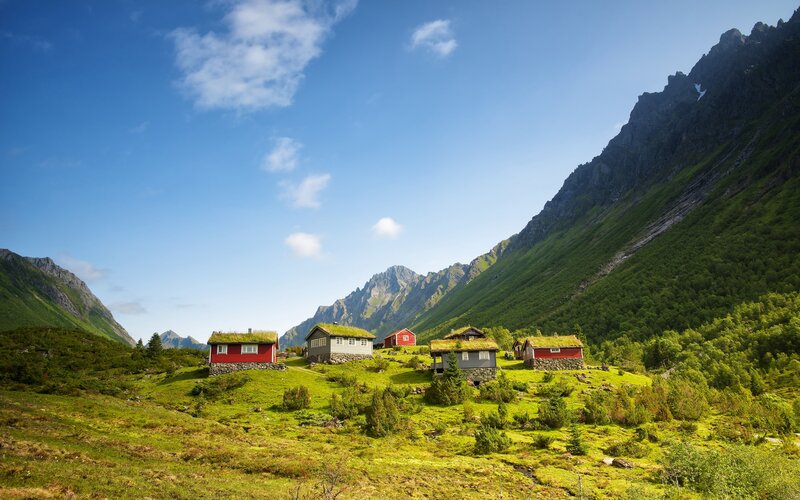 Red cabins in a mountain valley