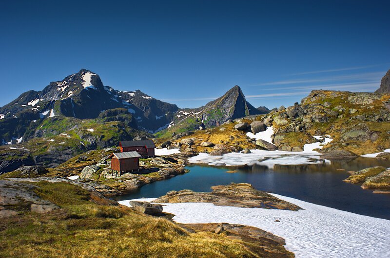 Red Cabins in Mountains — Blue
