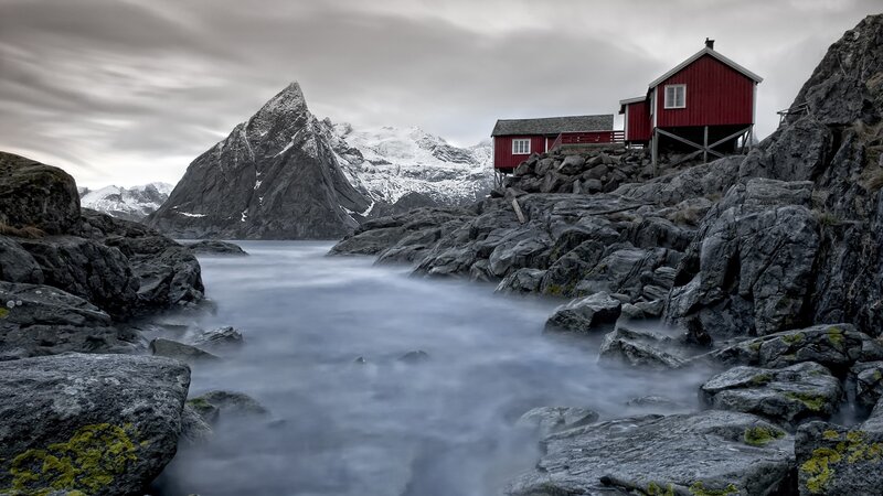 Red Cabins on Rocky Shore
