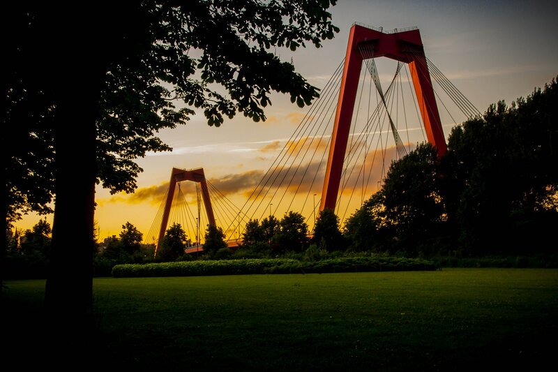 Red cable-stayed bridges at sunset